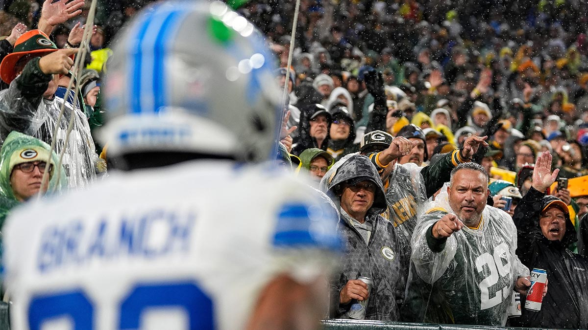 Green Bay Packers fans react as Detroit Lions safety Brian Branch walks off the field after being disqualified during the first half at Lambeau Field in Green Bay, Wisconsin, Sunday, Nov. 3, 2024.