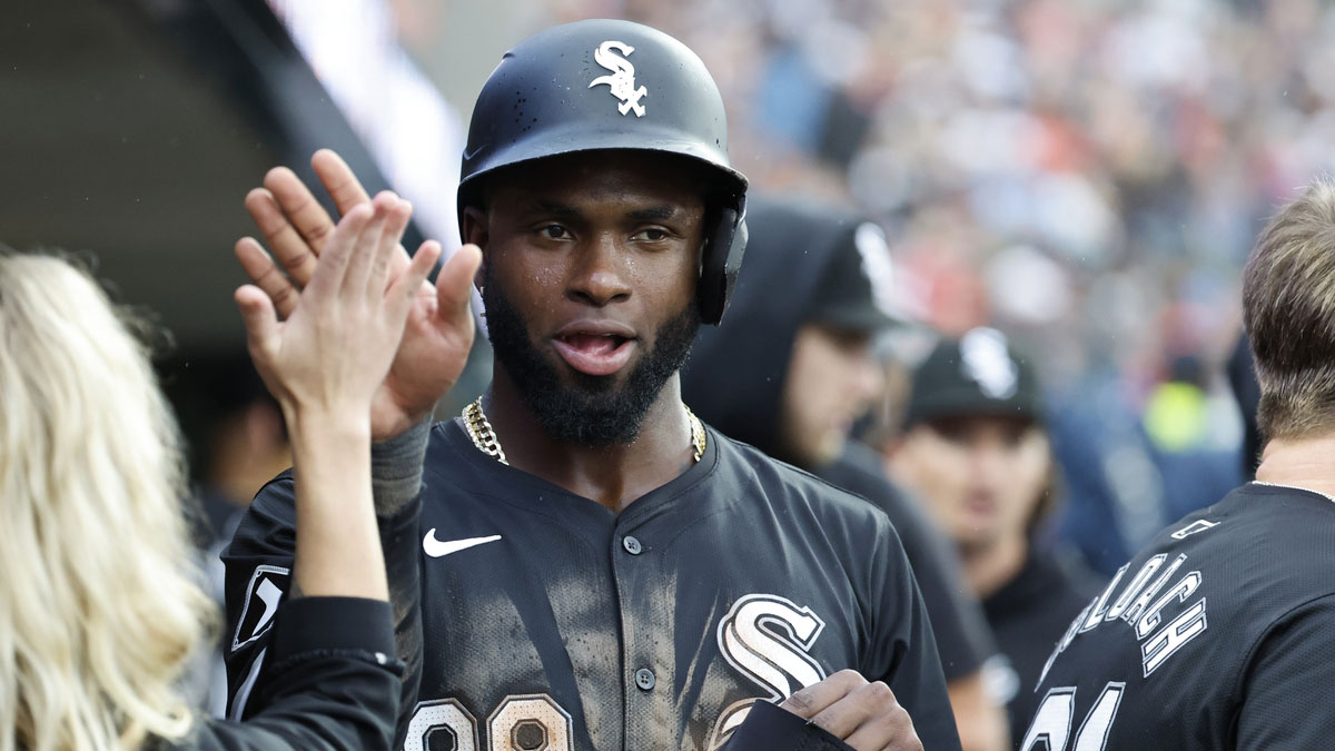 Chicago White Sox center fielder Luis Robert Jr. (88) receives congratulations from teammates after scoring in the seventh inning against the Detroit Tigers at Comerica Park.