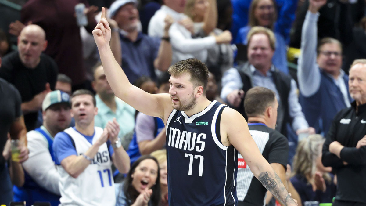 Dallas Mavericks Guard Luka Doncic (77) reacts during the fourth quarter against Phoenix Sunses to the center of American Airlines.