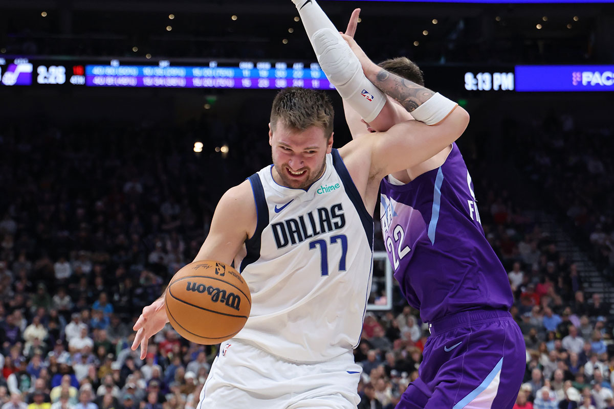 Dallas Mavericks guard Luka Doncic (77) drives against Utah Jazz forward Kyle Filipowski (22) during the fourth quarter at Delta Center. 