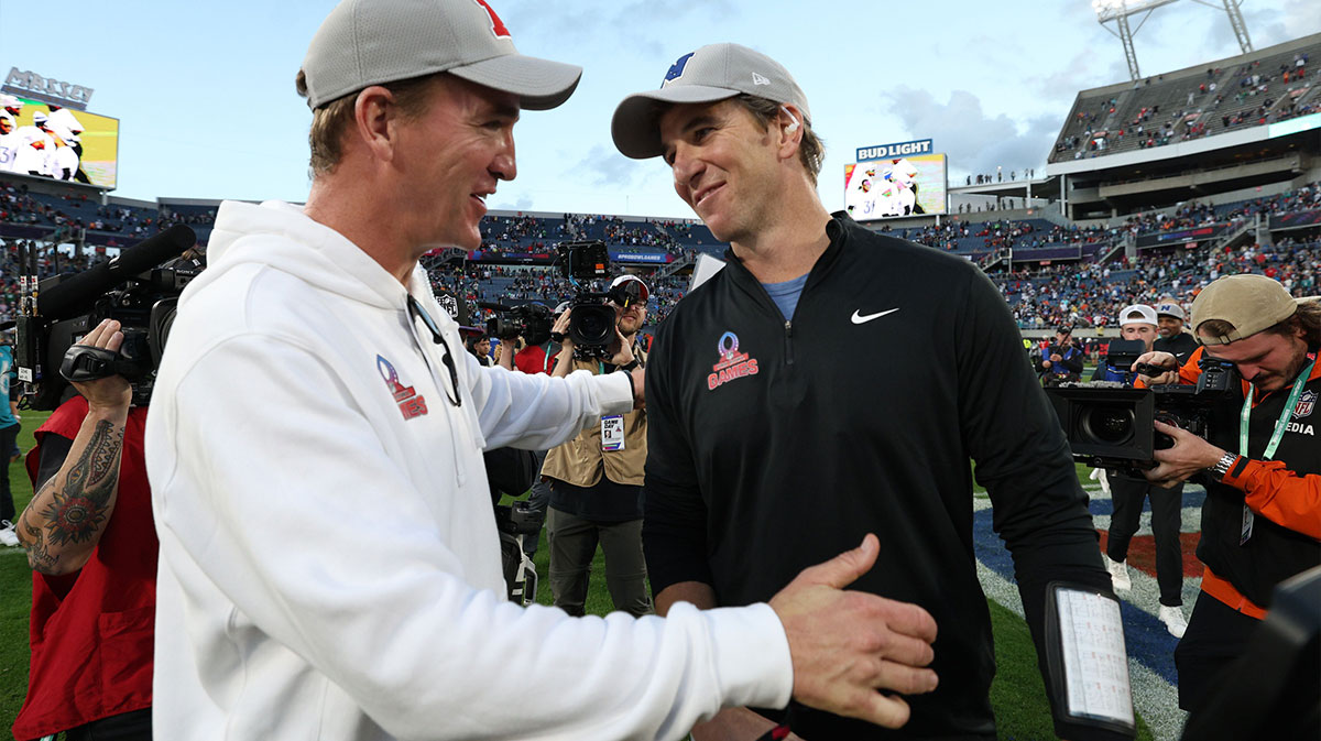 NFC coach Eli Manning and AFC coach Peyton Manning react after the 2024 Pro Bowl at Camping World Stadium.