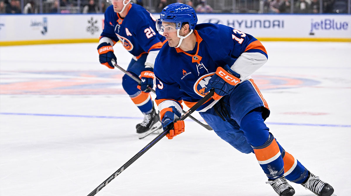 New York Islanders center Mathew Barzal (13) skates with the puck against the Florida Panthers during the second period at UBS Arena.