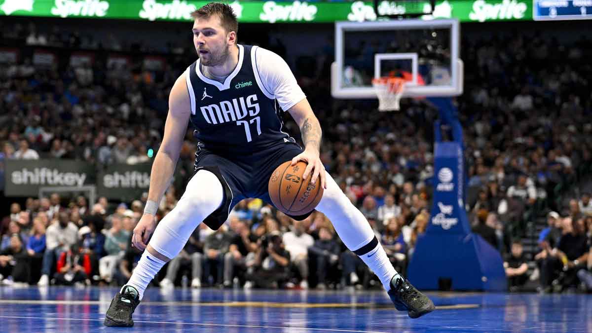 Dallas Mavericks guard Luka Doncic (77) brings the ball up court against the New Orleans Pelicans during the second half at the American Airlines Center.