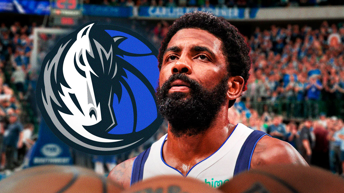Mavericks' Kyrie Irving looks up at injury paper before Hawks game