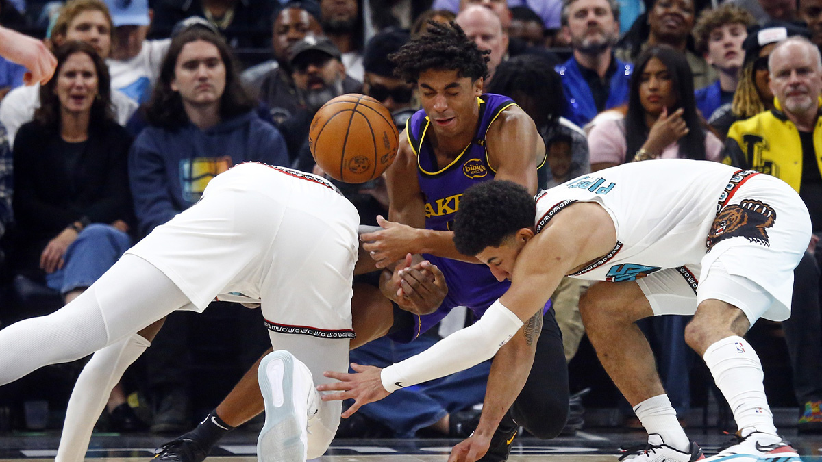 Los Angeles Lakers guard Max Christie (middle), Memphis Grizzlies forward Jaren Jackson Jr. (left) and guard Scotty Pippen Jr. (right) battle for a loose ball during the second half at FedExForum.