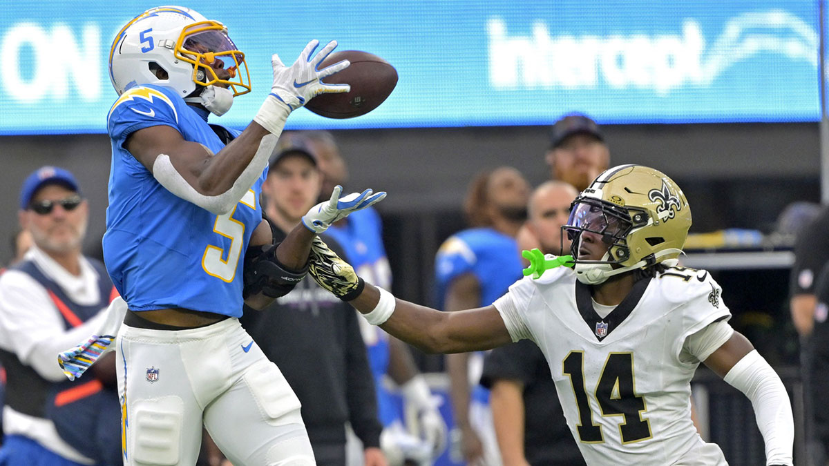 Los Angeles Chargers wide receiver Joshua Palmer (5) is stoped by New Orleans Saints cornerback Kool-Aid McKinstry (14) after a complete pass at the 18 yard line in the second half at SoFi Stadium.