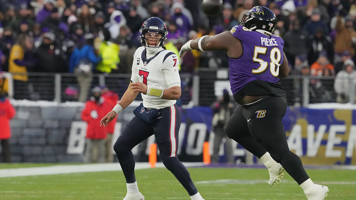 Jan 20, 2024; Baltimore, MD, USA; Houston Texans quarterback C.J. Stroud (7) throws a pass against Baltimore Ravens defensive tackle Michael Pierce (58) during the first quarter of a 2024 AFC divisional round game at M&T Bank Stadium. 