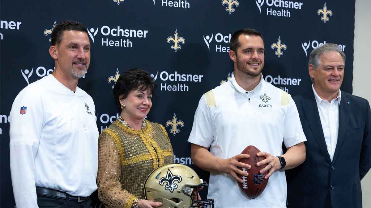 New Orleans Saints head coach Dennis Allen and CEO Gayle Benson and quarterback Derek Carr and general manager Mickey Loomis pose at the Ochsner Sports Performance Center.