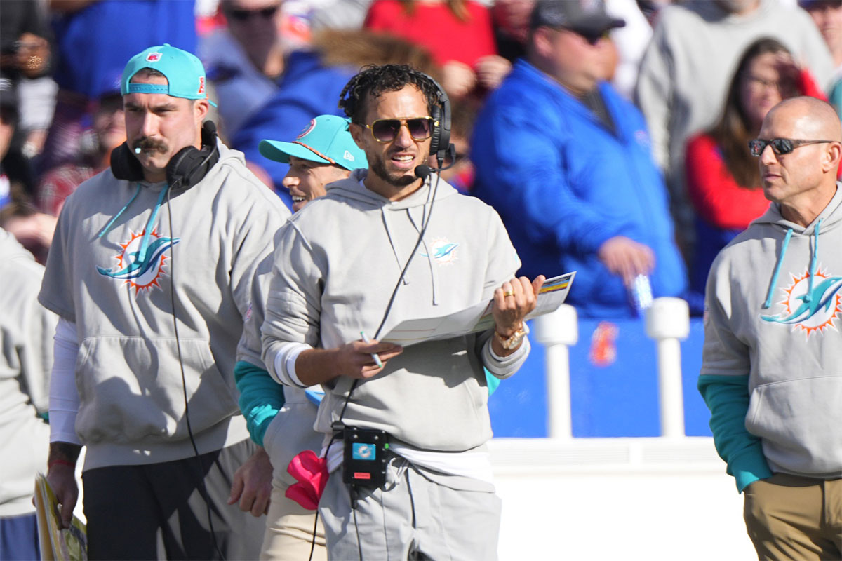 Miami Dolphins head coach Mike McDaniel with his play card on the sidelines during the first half against the Buffalo Bills at Highmark Stadium.
