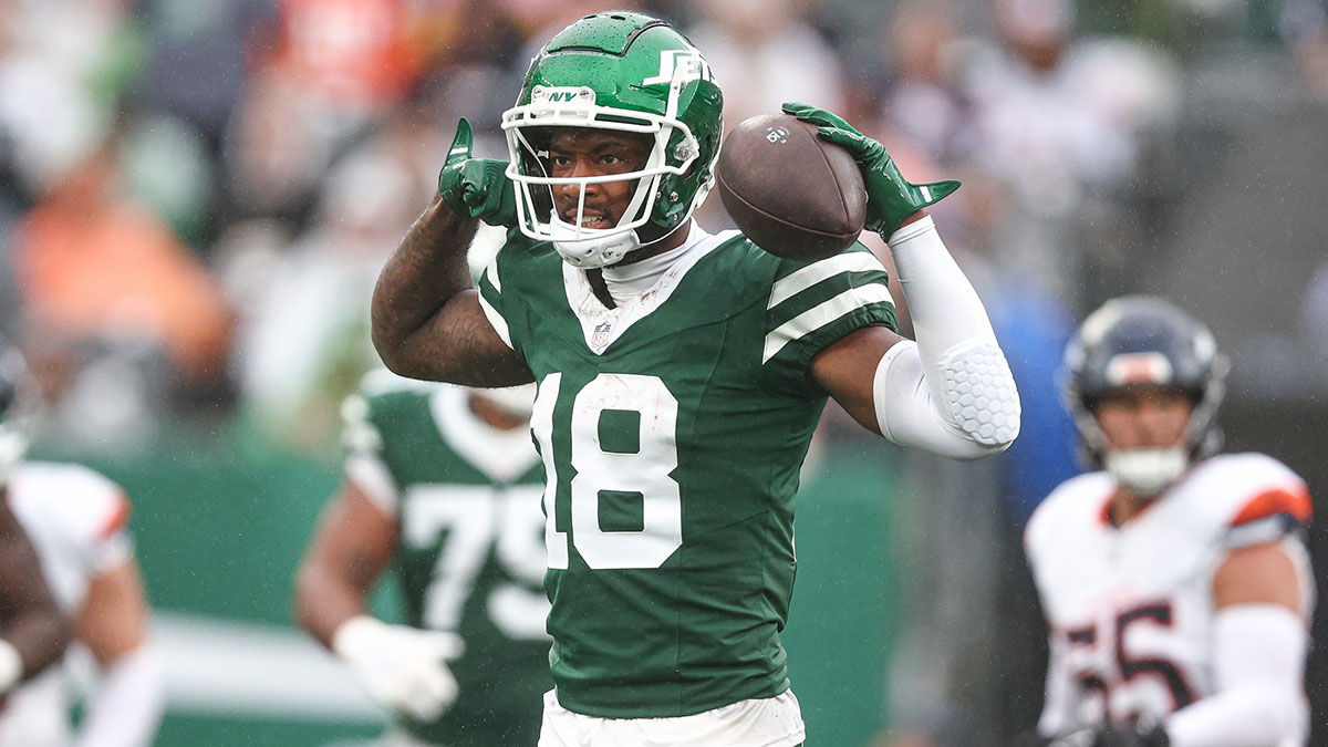 Sep 29, 2024; East Rutherford, New Jersey, USA; New York Jets wide receiver Mike Williams (18) celebrates a first down reception during the second half against the Denver Broncos at MetLife Stadium.