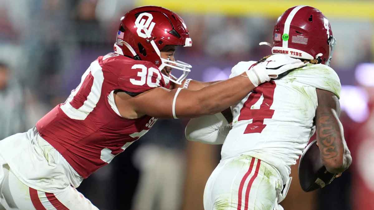 Oklahoma Sooners defensive lineman Trace Ford (30) chases after Alabama Crimson Tide quarterback Jalen Milroe (4) during a college football game between the University of Oklahoma Sooners (OU) and the Alabama Crimson Tide at Gaylord Family - Oklahoma Memorial Stadium in Norman, Okla., Saturday, Nov. 23, 2024. Oklahoma won 24-3.