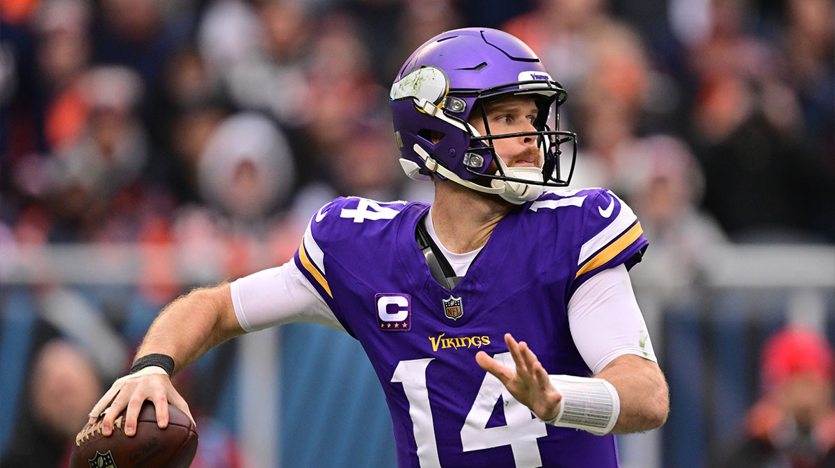 Minnesota Vikings quarterback Sam Darnold (14) passes the ball against the Chicago Bears during the third quarter at Soldier Field.
