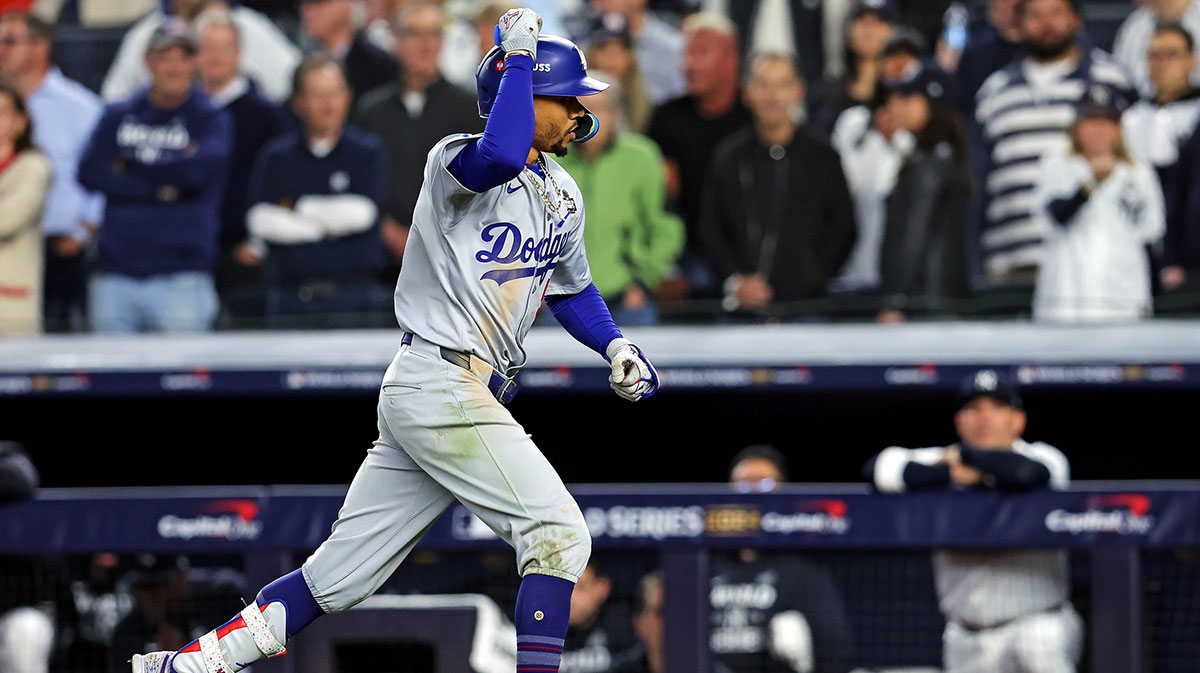 Los Angeles Dodgers shortstop Mookie Betts (50) celebrates after hitting a sacrifice fly during the eighth inning against the New York Yankees in game four of the 2024 MLB World Series at Yankee Stadium. 