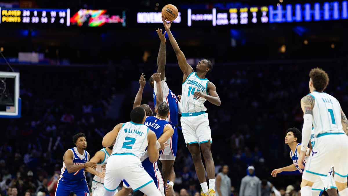 Charlotte Hornets forward Moussa Diabate (14) tips off against Philadelphia 76ers center Andre Drummond (5) in overtime at Wells Fargo Center.