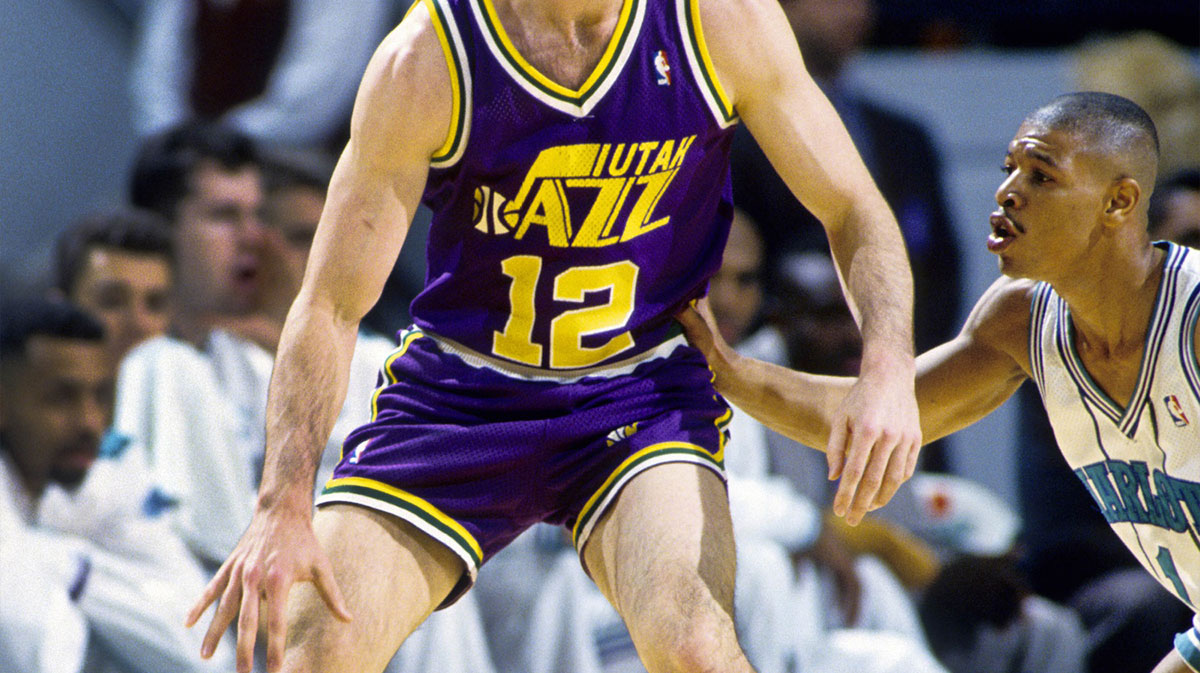 Utah Jazz guard John Stockton (12) is defended by Charlotte Hornets guard Muggsy Bogues (1) at the Charlotte Arena.