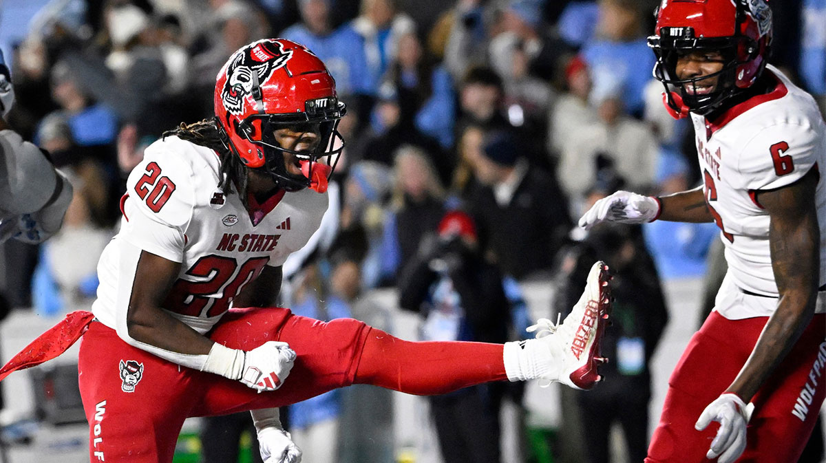 North Carolina State Wolfpack running back Hollywood Smothers (20) reacts after scoring a touchdown with 25 seconds to go in the fourth quarter at Kenan Memorial Stadium.