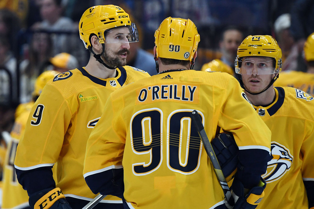 Nashville Predators center Ryan O'Reilly (90) talks with left wing Filip Forsberg (9) and center Gustav Nyquist (14) during the first period against the Montreal Canadiens at Bridgestone Arena.