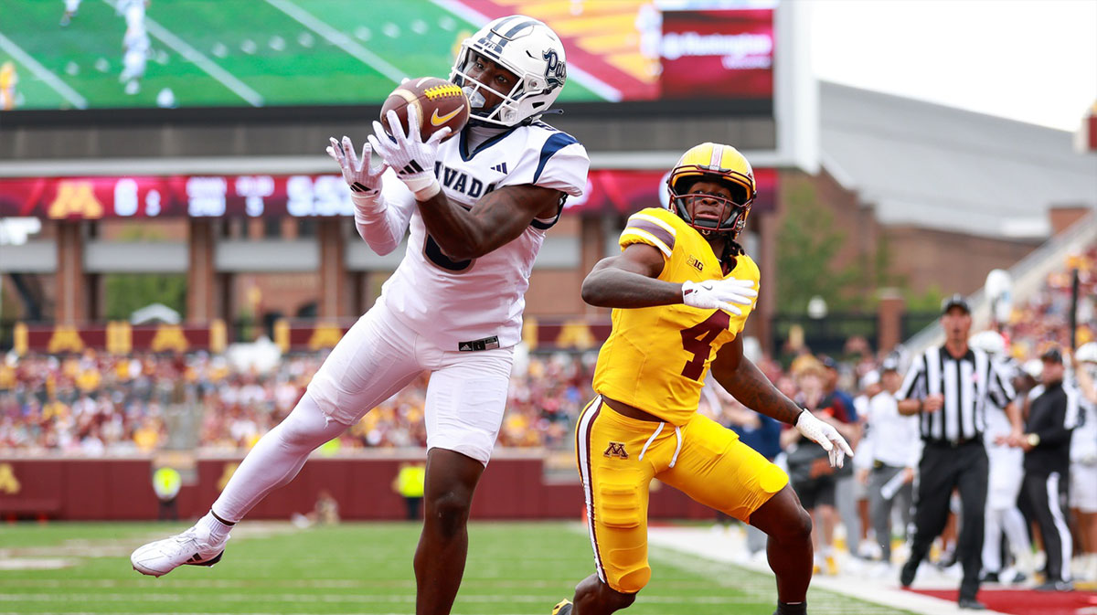 Nevada Wolf Pack safety Keyshawn Cobb (5) intercepts a pass intended for Minnesota Golden Gophers wide receiver Cristian Driver (4) during the first half at Huntington Bank Stadium