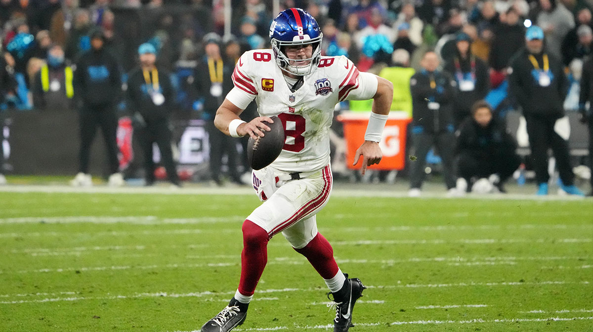 New York Giants quarterback Daniel Jones (8) carries the ball against the New York Giants in the second half during the 2024 NFL Munich Game at Allianz Arena.