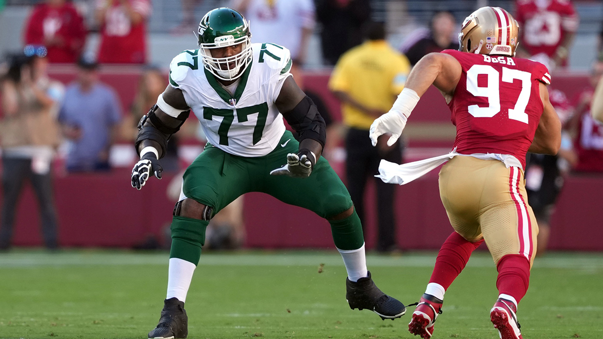 New York Jets offensive tackle Tyron Smith (77) blocks against San Francisco 49ers defensive end Nick Bosa (97) during the first quarter at Levi's Stadium.