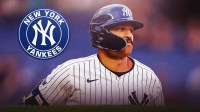 Yankees' Trent Grisham next to contract sign