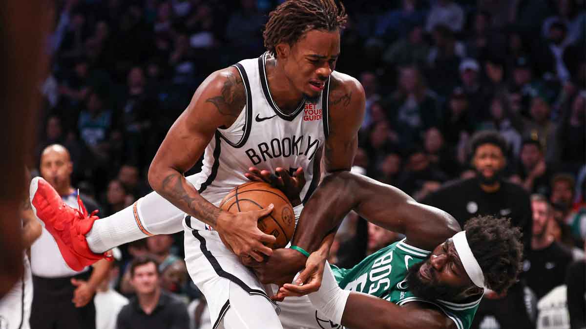 Brooklyn Nets center Nic Claxton (33) rebounds against Boston Celtics center Neemias Queta (88) during the first half at Barclays Center.