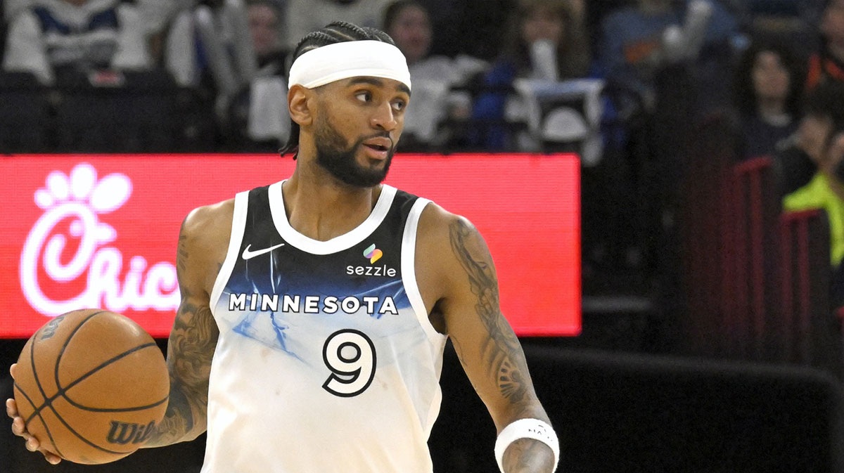 Minnesota Timberwolves forward Nickeil Alexander-Walker (9) brings the ball up court against the Phoenix Suns during the fourth quarter at Target Center