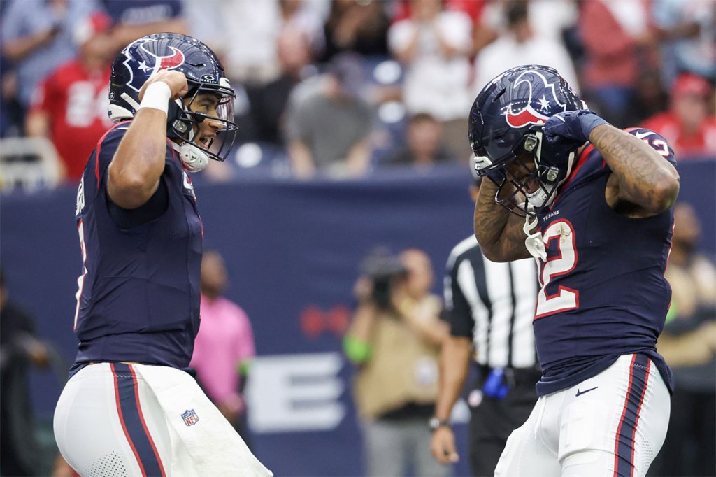 Houston Texans quarterback C.J. Stroud (7) celebrates wide receiver Nico Collins (12) touchdown reception against the Tampa Bay Buccaneers in the first quarter at NRG Stadium.