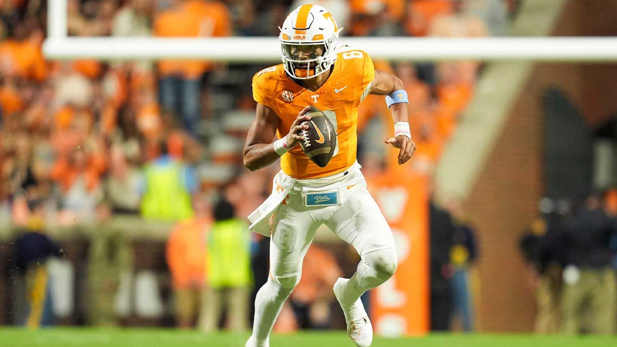 Tennessee Volunteers quarterback Nico Iamaleava (8) rolls out to pass against the Mississippi State Bulldogs during the first half at Neyland Stadium.