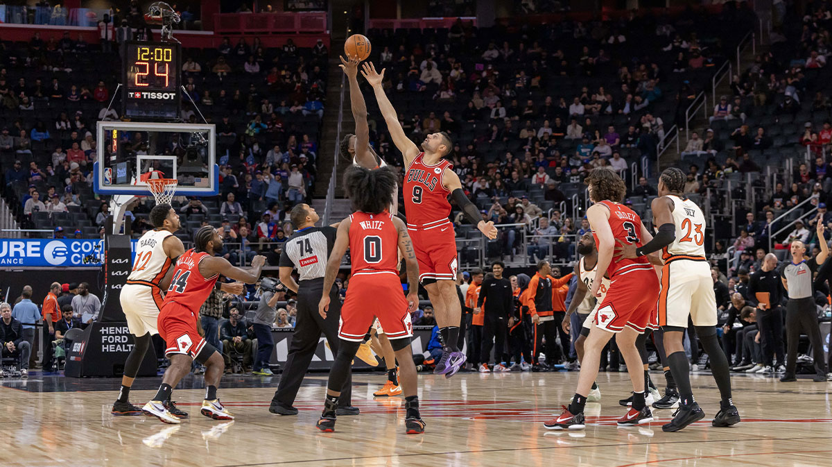 The jump ball between Chicago Bulls center Nikola Vucevic (9) and Detroit Pistons center Jalen Duren (0) to start the first half at Little Caesars Arena.