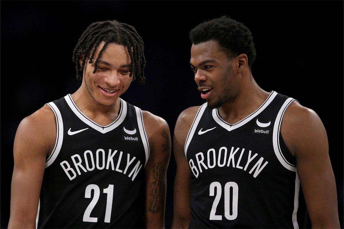 Brooklyn Nets center Day'Ron Sharpe (20) talks to forward Noah Clowney (21) during the second quarter against the Toronto Raptors at Barclays Center.