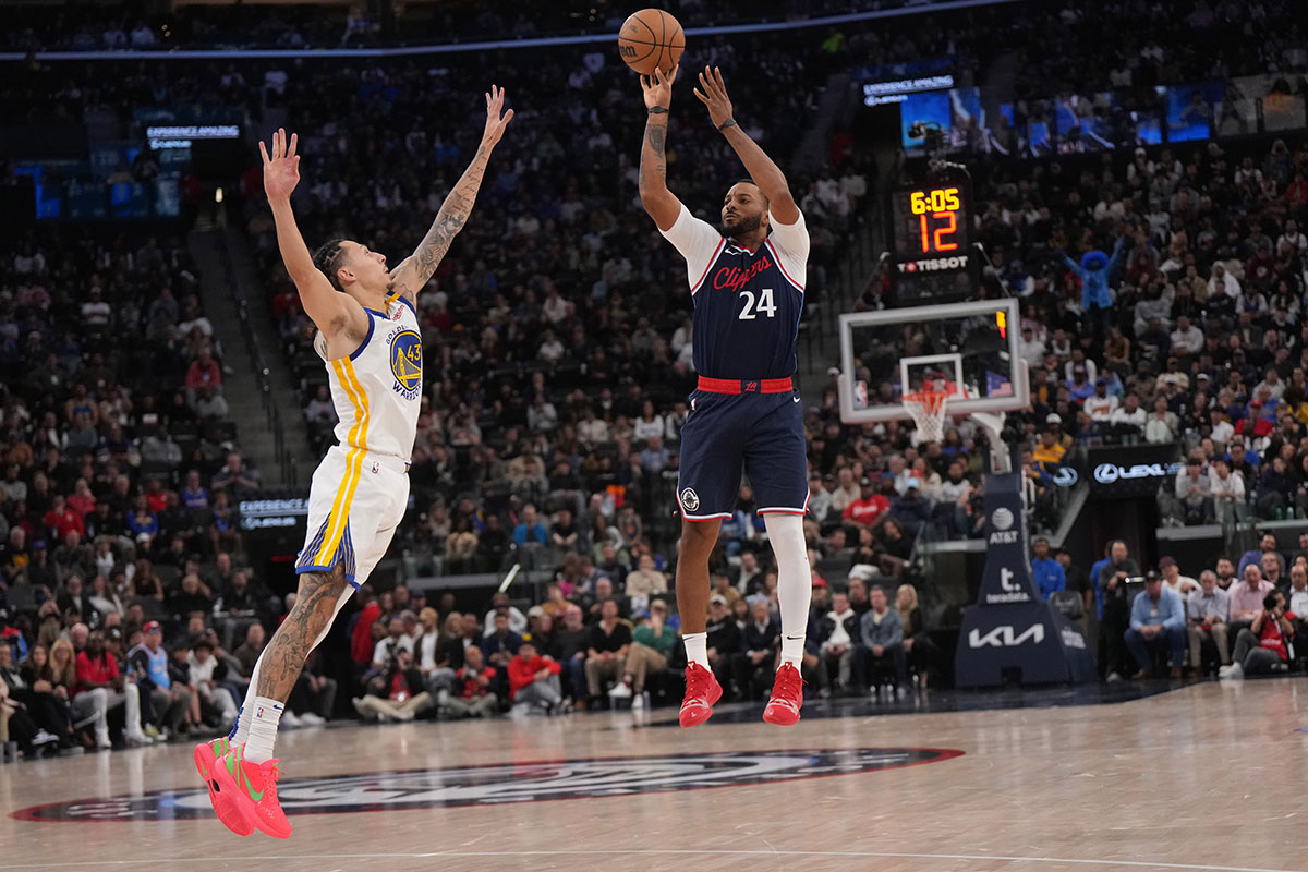 LA Clippers guard Norman Powell (24) shoots the ball against Golden State Warriors forward Lindy Waters III (43) in the second half at Intuit Dome.