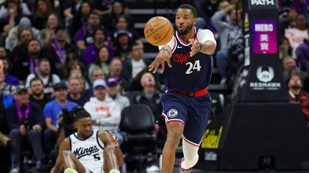 Los Angeles Clippers guard Norman Powell (24) passes Sacramento Kings guard De'Aaron Fox (5) during the fourth quarter at Golden 1 Center.