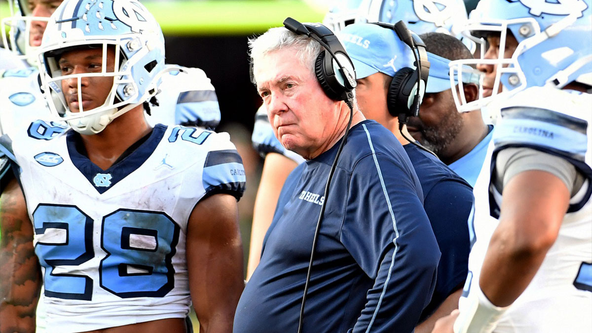 North Carolina Tarheels head coach Mack Brown looks on with his players during an injury time out in the third quarter against the Florida State Seminoles at Doak S. Campbell Stadium.