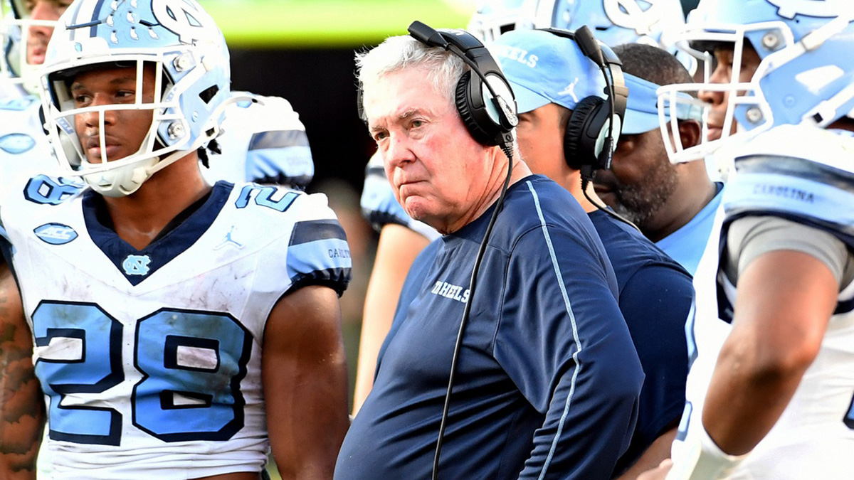 North Carolina Tarheels head coach Mack Brown looks on with his players during an injury time out in the third quarter against the Florida State Seminoles at Doak S. Campbell Stadium