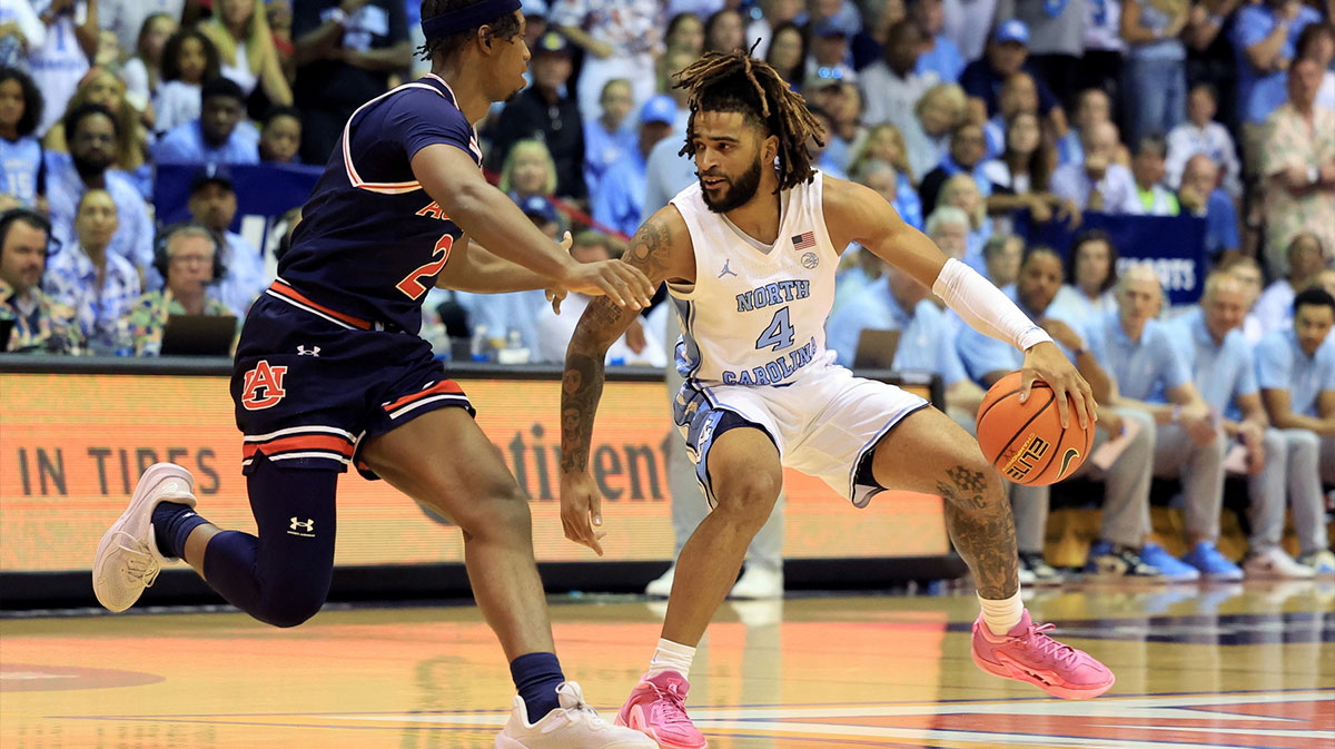 North Carolina Tar Heels guard RJ Davis (4) dribbles against Auburn Tigers guard Denver Jones during the first half at Lahaina Civic Center.