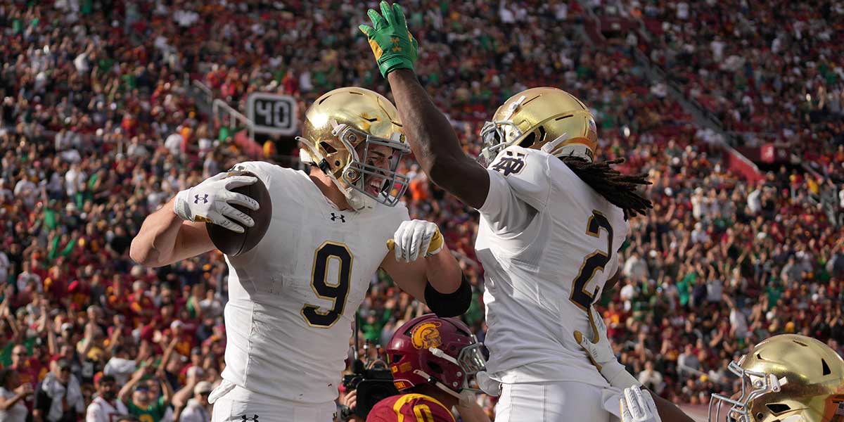 Notre Dame Fighting Irish tight end Eli Raridon (9) celebrates with wide receiver Jayden Harrison (2) after catching a 12 yard touchdown pass against the Southern California Trojans in the first half at United Airlines Field at Los Angeles Memorial Coliseum.