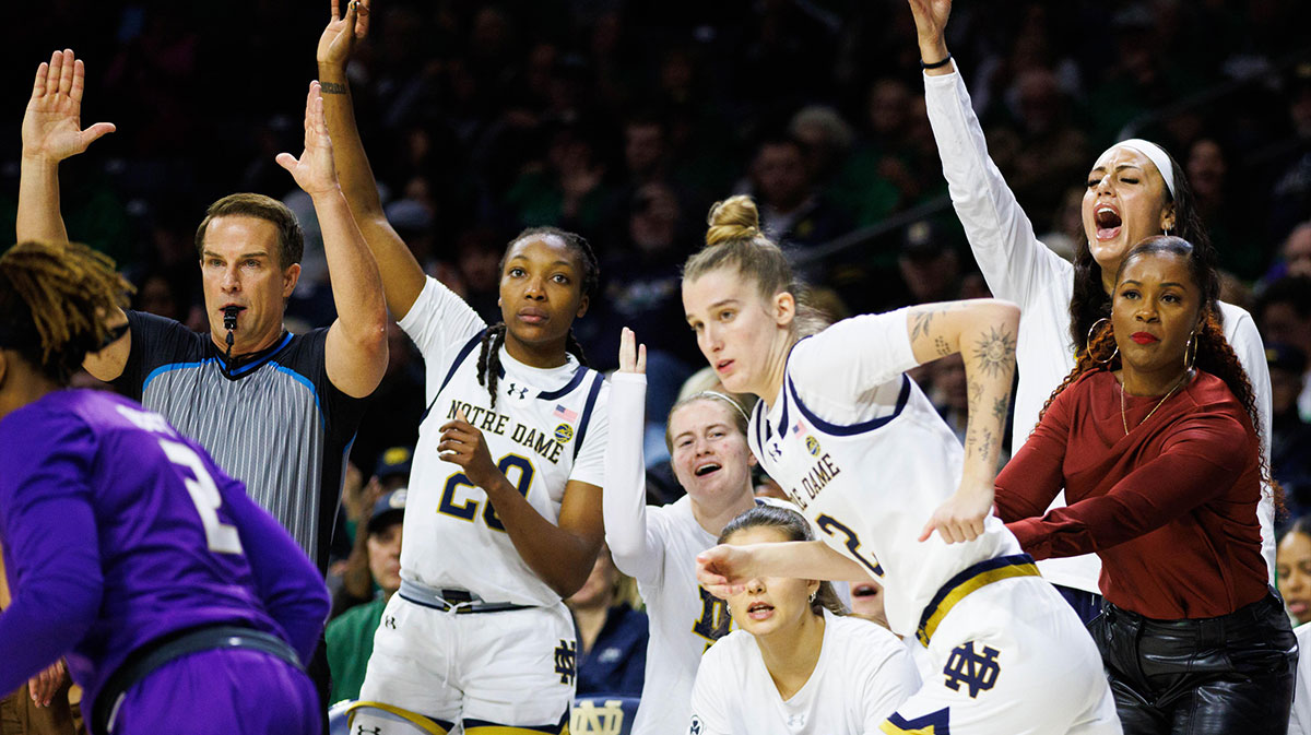 Notre Dame women's basketball's bench celebrates a three point shot made by guard Emma Risch (2) during a NCAA women's basketball game against James Madison.