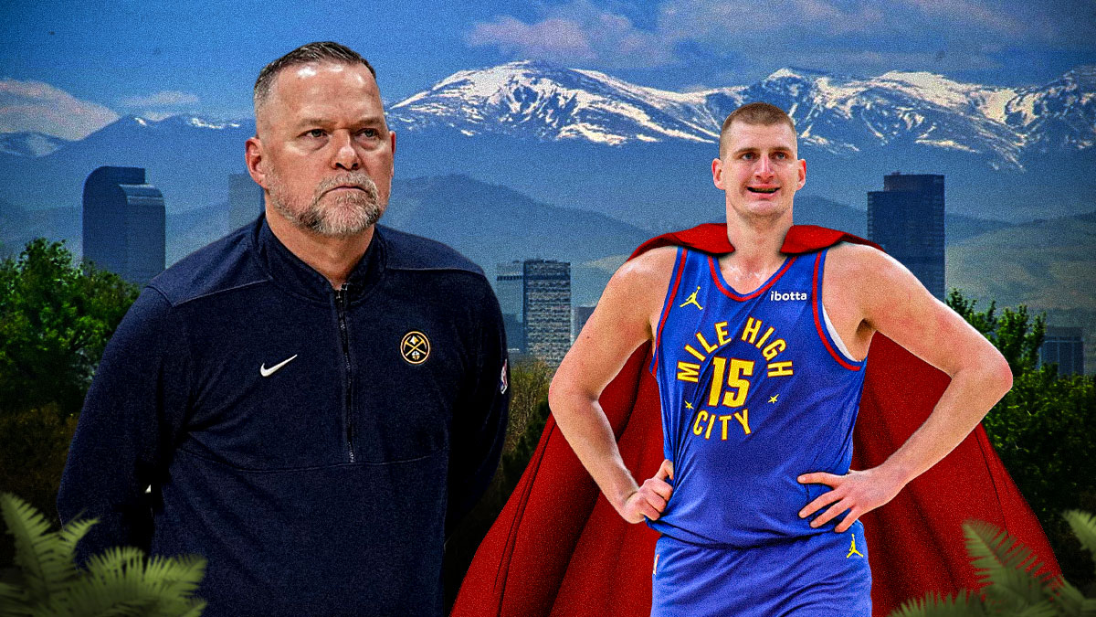 Michael Malone with stoic expression next to Nuggets' Nikola Jokic with a Superman cape on