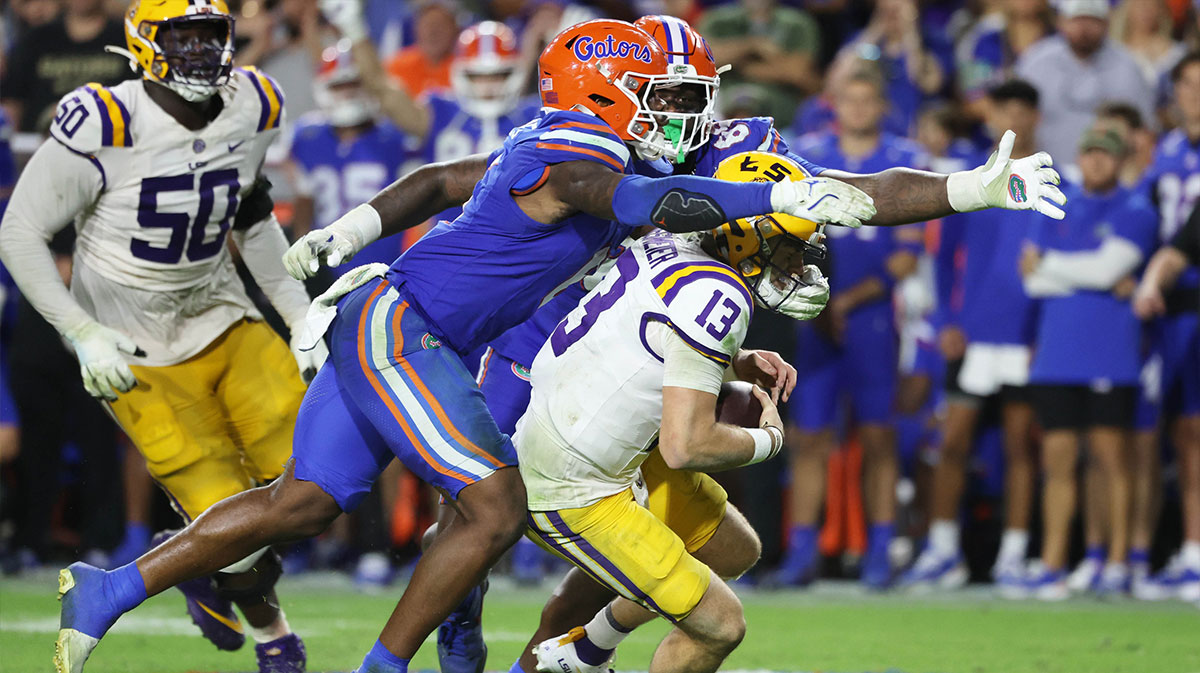 Florida Gators linebacker Shemar James (6) and defensive lineman Caleb Banks (88) sack LSU Tigers quarterback Garrett Nussmeier (13) during the second half at Ben Hill Griffin Stadium.