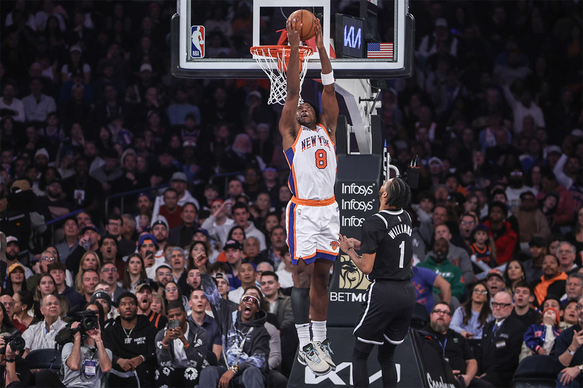 Nov 17, 2024; New York, New York, USA; New York Knicks forward OG Anunoby (8) drives past Brooklyn Nets forward Ziaire Williams (1) for a reverse dunk in the first quarter at Madison Square Garden. Mandatory Credit: Wendell Cruz-Imagn Images