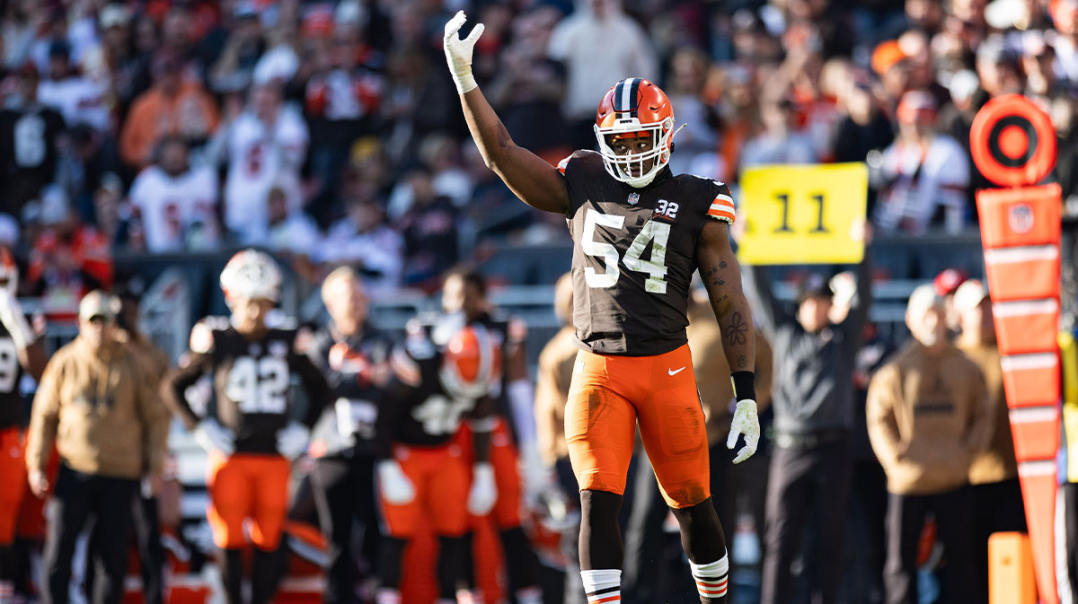 Cleveland Browns defensive end Ogbo Okoronkwo (54) raises his arm to pump up the crowd against the Pittsburgh Steelers during the third quarter at Cleveland Browns Stadium.