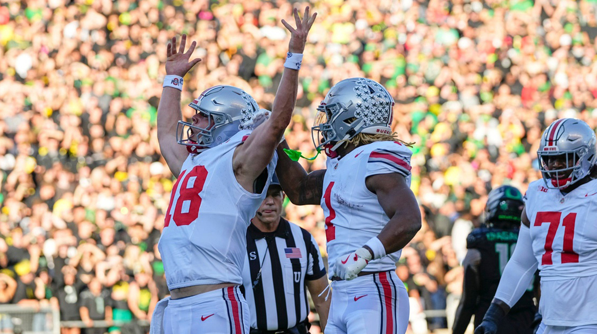 Oct 12, 2024; Eugene, Oregon, USA; Ohio State Buckeyes quarterback Will Howard (18) celebrates scoring a touchdown during the first half of the NCAA football game against the Oregon Ducks at Autzen Stadium