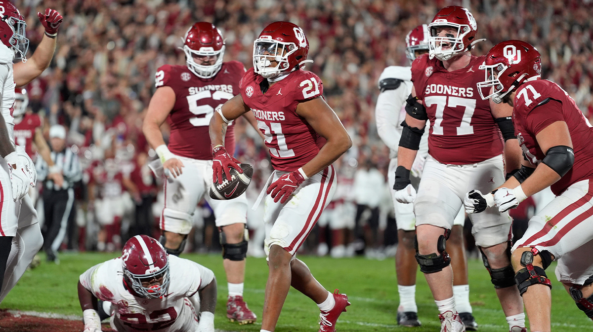 Oklahoma Sooners running back Xavier Robinson (21) celebrates after rushing for a touchdown during a college football game between the University of Oklahoma Sooners (OU) and the Alabama Crimson Tide at Gaylord Family - Oklahoma Memorial Stadium in Norman, Okla.,
