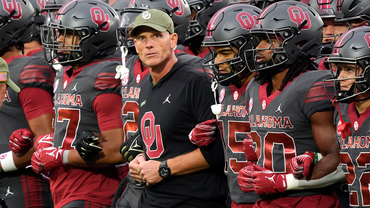 Oklahoma coach Brent Venables locks arms with players before a college football game between the University of Oklahoma Sooners (OU) and the Maine Black Bears at Gaylord Family - Oklahoma Memorial Stadium in Norman, Okla., Saturday, Nov. 2, 2024.