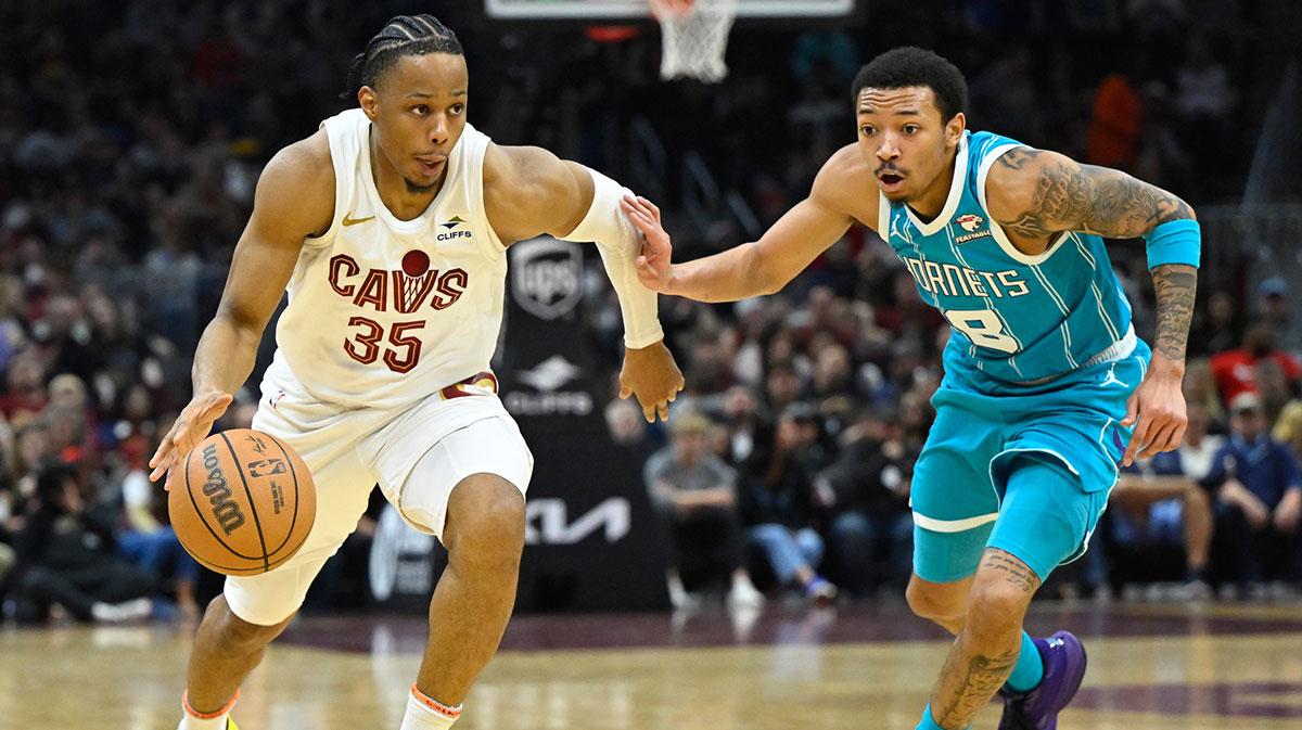 Cleveland Cavaliers forward Isaac Okoro (35) dribbles against Charlotte Hornets guard Nick Smith Jr. (8) in the second quarter at Rocket Mortgage FieldHouse.