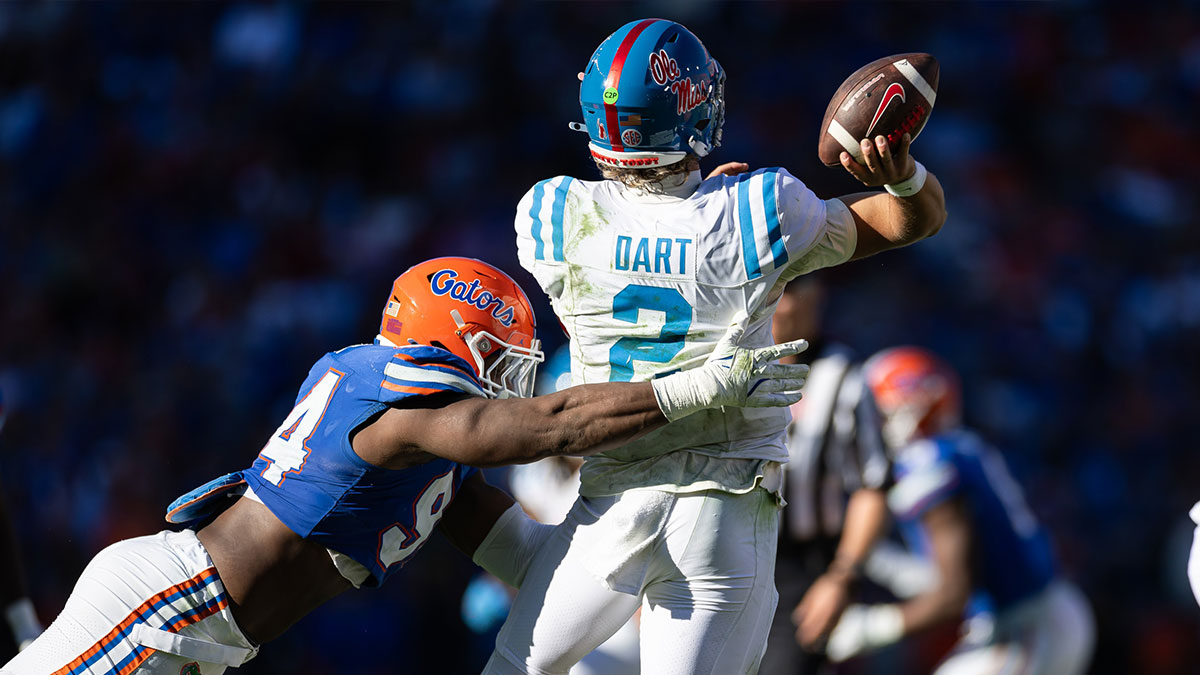 Florida Gators defensive end Tyreak Sapp (94) pressures Mississippi Rebels quarterback Jaxson Dart (2) while he throws the ball during the second half at Ben Hill Griffin Stadium. 