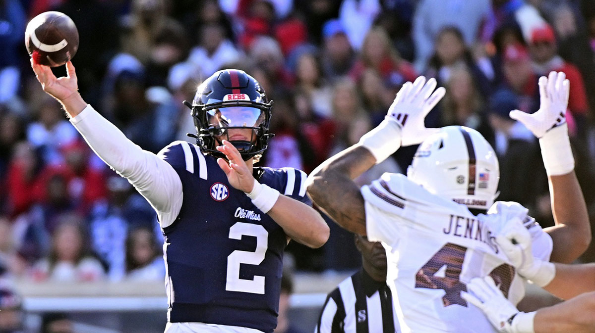 Mississippi Rebels quarterback Jaxson Dart (2) looks to pass while defended by Mississippi State Bulldogs linebacker Branden Jennings (44) during the first quarter at Vaught-Hemingway Stadium.