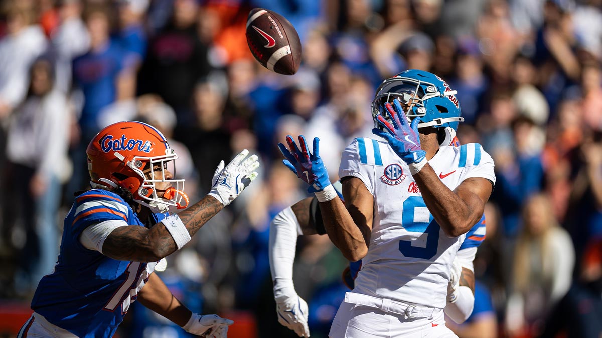 Mississippi Rebels wide receiver Tre Harris (9) makes a catch for a touchdown over Florida Gators defensive back Bryce Thornton (18) during the first half at Ben Hill Griffin Stadium.