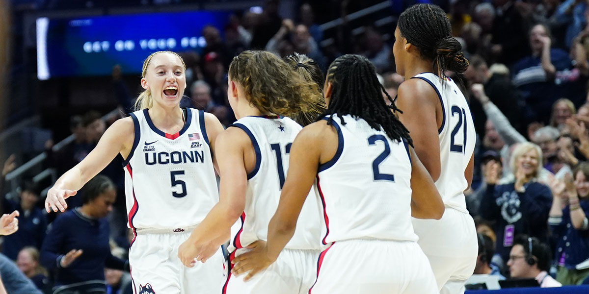 UConn Huskies guard Paige Bueckers (5) reacts after guard Ashlynn Shade (12) makes the buzzer beater three point basket against the South Florida Bulls in the first half at Harry A. Gampel Pavilion. 